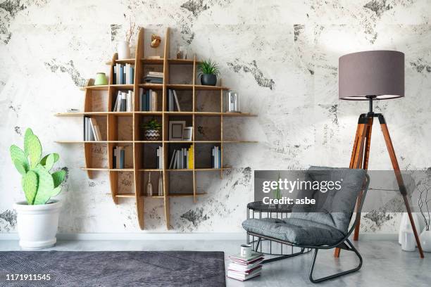 diseño de estantería creativa con sillón - libreria fotografías e imágenes de stock