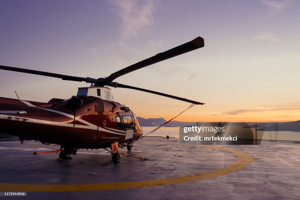 Helicopter parking landing on offshore platform, Helicopter transfer passenger