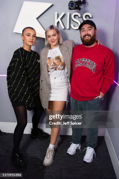 Anne-Marie , pictured with Daisy Maskell and Tom Green , visits the Kiss FM Studio's on September 03, 2019 in London, England.