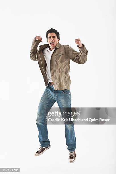 man jumping on a white background - cheering stock pictures, royalty-free photos & images