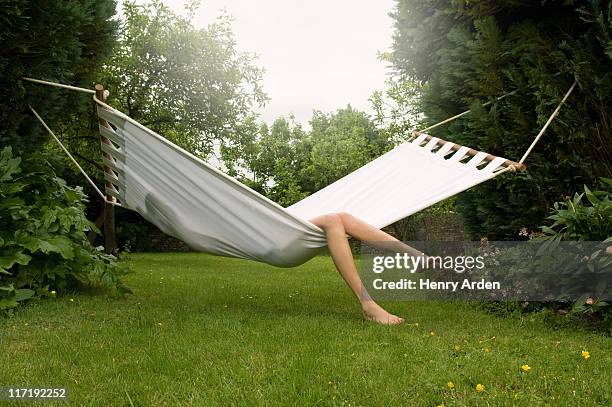 female relaxing in hammock - garden hammock stock pictures, royalty-free photos & images