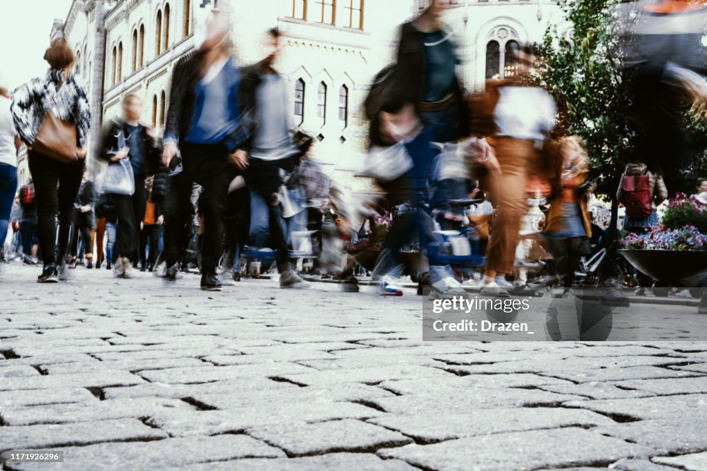 Crowded streets and motion blur in city, multi-ethnic large group of people in Oslo, Norway