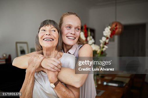 Cheerful mother and daughter at home Cheerful mother and daughter at home