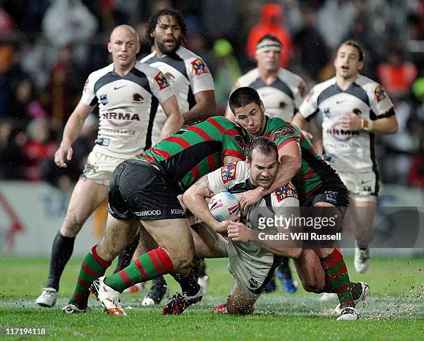 Scott Anderson of the Broncos is tackled during the round 16 NRL match between the South Sydney Rabbitohs and the Brisbane Broncos at NIB Stadium on...
