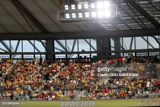 Supporters attend the Japan 2019 Rugby World Cup Pool D match between Australia and Wales at the Tokyo Stadium in Tokyo on September 29, 2019.
