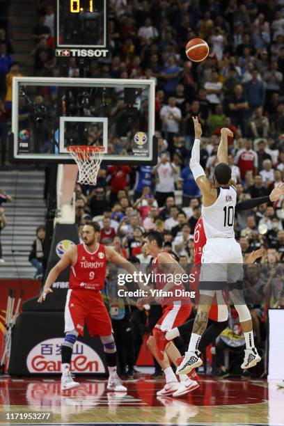 Cedi Osman of Turkey fouls on Jayson Tatum of USA at the last seconds during the 1st round match between USA and Turkey of 2019 FIBA World Cup at...