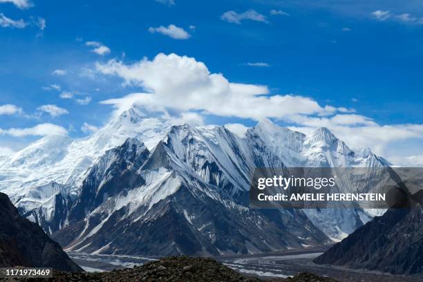 This picture taken on August 15, 2019 shows a view of snow-capped mountains and glaciers from the Concordia camping site in the Karakoram range of...