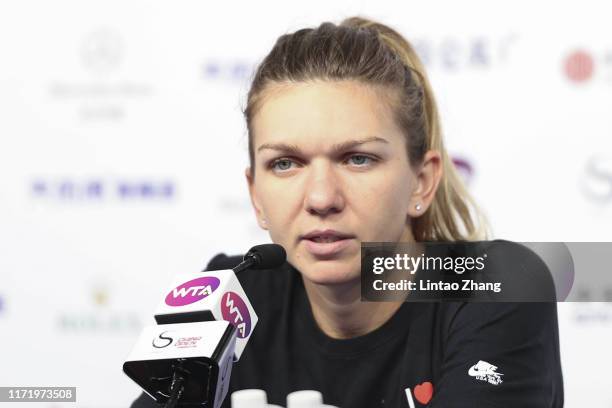 Simona Halep of Romania attends a press conference after win her women's singles first round match against Rebecca Peterson of Sweden during women's...