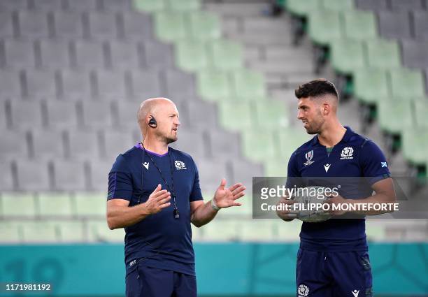 Scotland's coach Gregor Townsend and fly-half Adam Hastings take part in a captain's run training session at the Misaki Rugby Stadium in Kobe on...