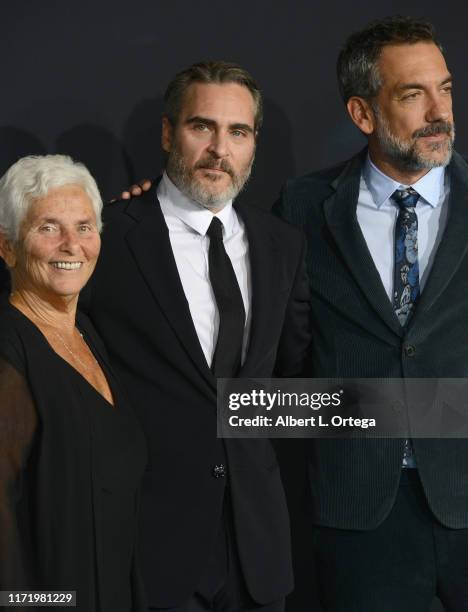 Joaquin Phoenix, mother Arlyn Phoenix and Todd Phillips arrive for the Premiere Of Warner Bros Pictures "Joker" held at TCL Chinese Theatre IMAX on...