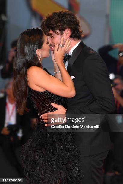 Cecilia Rodríguez and Ignazio Moser kiss walking the red carpet ahead of the "Om Det Oandliga" screening during the 76th Venice Film Festival at Sala...