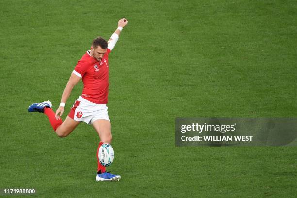 Wales' fly-half Dan Biggar kicks a drop goal during the Japan 2019 Rugby World Cup Pool D match between Australia and Wales at the Tokyo Stadium in...