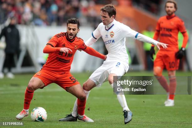 Othman El Kabir of FC Ural Yekaterinburg and Mario Fernandes of PFC CSKA Moscow vie for the ball during the Russian Premier League match between FC...