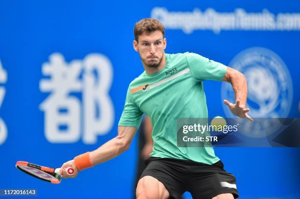 Pablo Carreno Busta of Spain hits a return against Alexander Bublik of Kazakhstan during their men's singles final match at the Chengdu Open tennis...