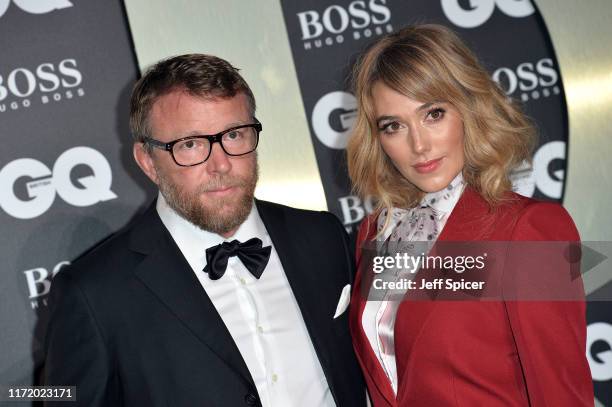 Guy Ritchie and Jacqui Ainsley attend the GQ Men Of The Year Awards 2019 at Tate Modern on September 03, 2019 in London, England.