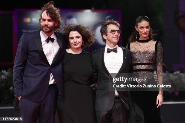 Rossif Sutherland, Arsinee Khanjian director Atom Egoyan and Laysla De Oliveira walk the red carpet ahead of the "Guest of Honour" screening during...