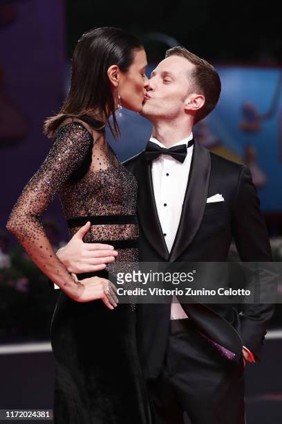 Laysla De Oliveira and Jonathan Keltz walk the red carpet ahead of the "Guest of Honour" screening during the 76th Venice Film Festival at Sala...