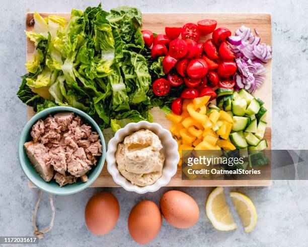 egg and tuna salad ingredients on a chopping board - seafood salad stock pictures, royalty-free photos & images