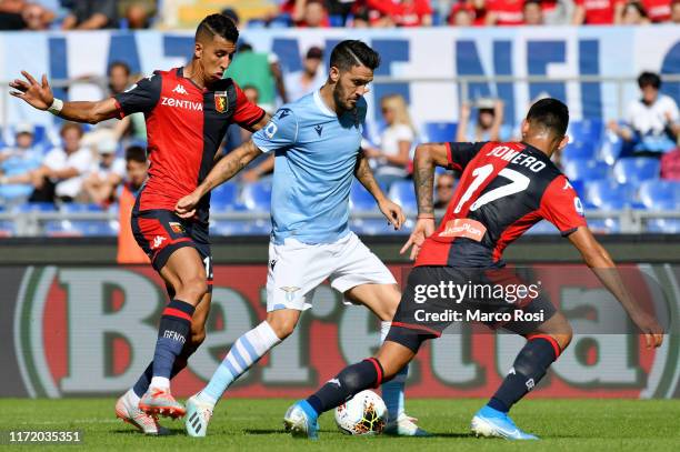 Luis Alberto of SS Lazio compete for the ball with Jawad El Yamiq during the Serie A match between SS Lazio and Genoa CFC at Stadio Olimpico on...