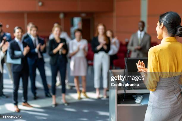 successful presentation - woman presenter stock pictures, royalty-free photos & images