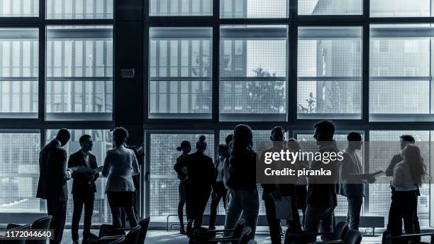 business people attending a conference - business conference stock pictures, royalty-free photos & images