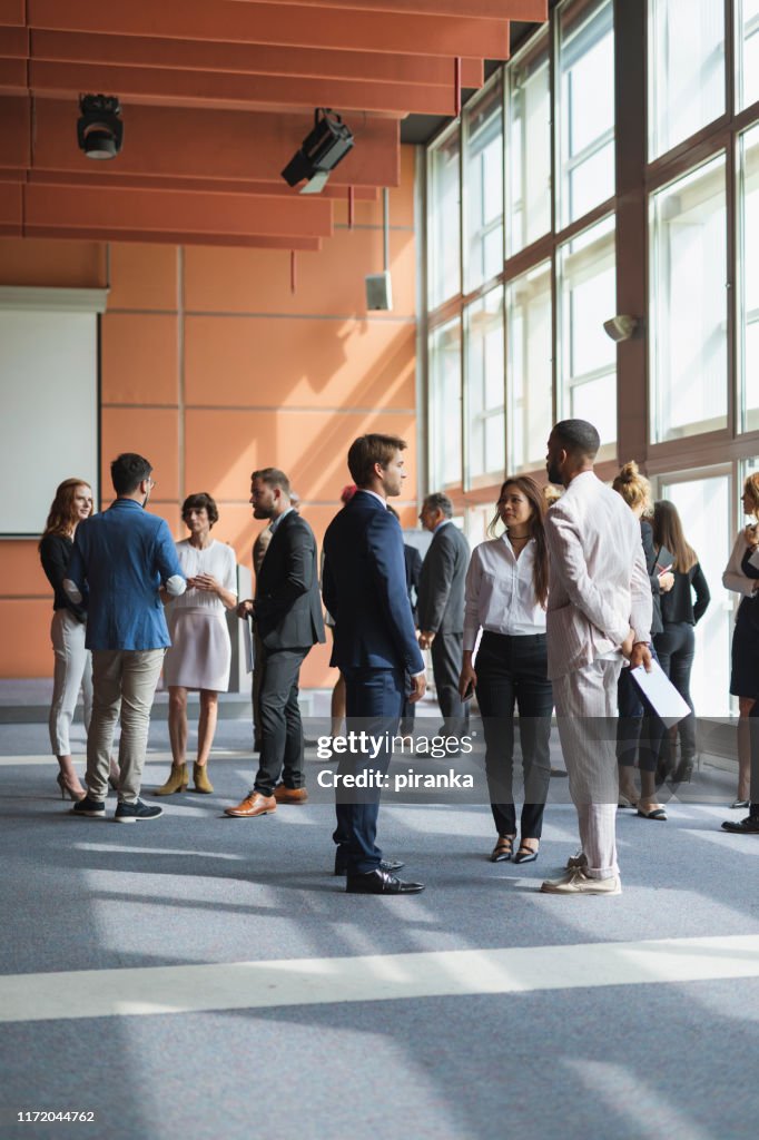 Business people attending a conference