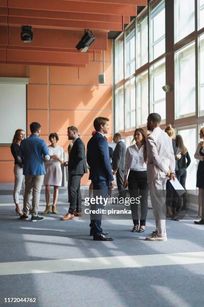 business people attending a conference - business conference stock pictures, royalty-free photos & images