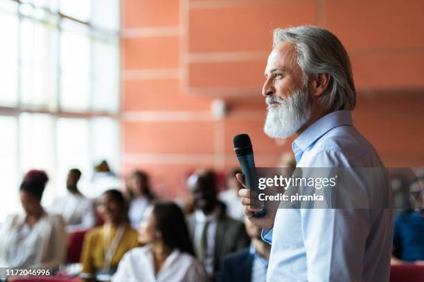 portrait of a business presenter - motivational speaker stock pictures, royalty-free photos & images