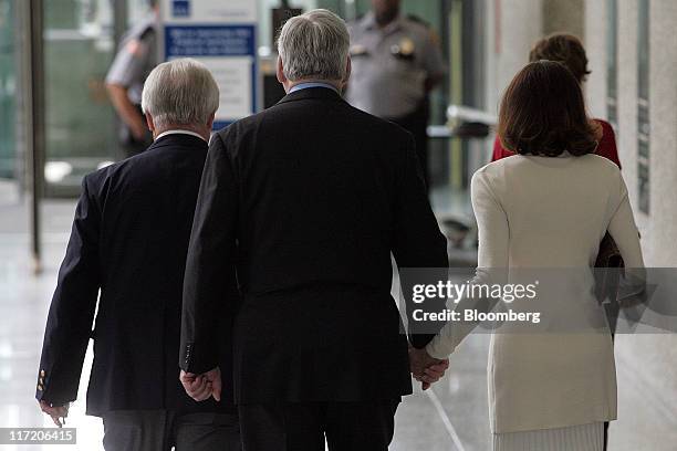 Conrad Black, former chairman of Hollinger International Inc., center, arrives with his wife Barbara Amiel, right, at the Dirksen Federal Courthouse...
