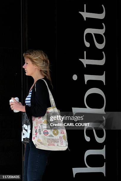 Woman leaves a Habitat store in central London on June 24, 2011. Britain's Home Retail Group on Friday said it had bought the Habitat UK brand and...