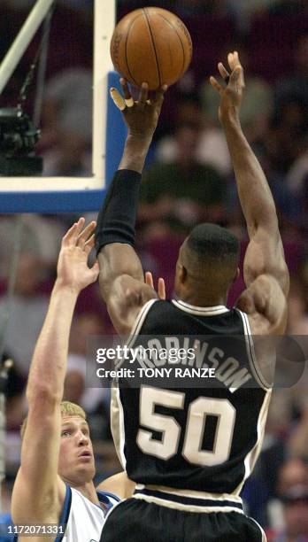 San Antonio Spurs' center David Robinson shoots over the top of Orlando Magic center Michael Doleac during the third period at the TD Waterhouse...