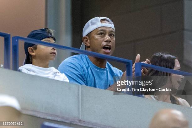 Open Tennis Tournament- Day Nine. Tiger Woods watching Serena Williams of the United States in action against Qiang Wang of China in the Women's...