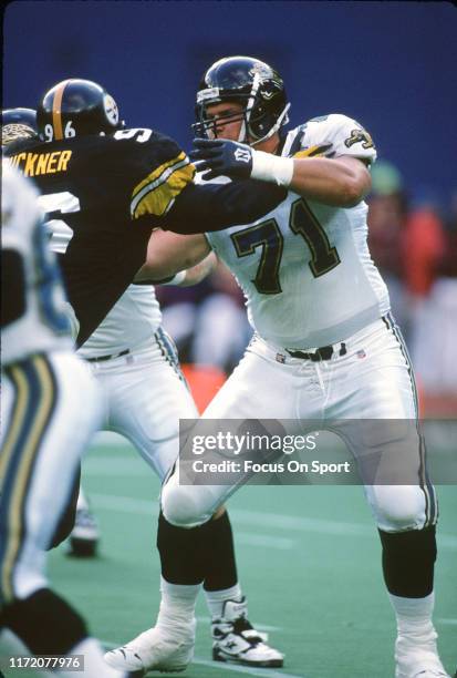 Tony Boselli of the Jacksonville Jaguars blocks Brentson Bucker of the Pittsburgh Steelers during an NFL football game November 17, 1996 at Three...