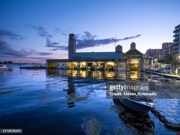 toronto city skyline at dusk - harbourfront area - police marine unit - toronto police marine unit stock pictures, royalty-free photos & images