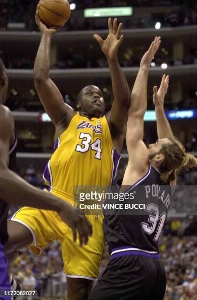 Los Angeles Lakers player Shaquille O'Neal jumps to score as Sacramento Kings Scott Pollard defends during their Western Conference Semifinals...