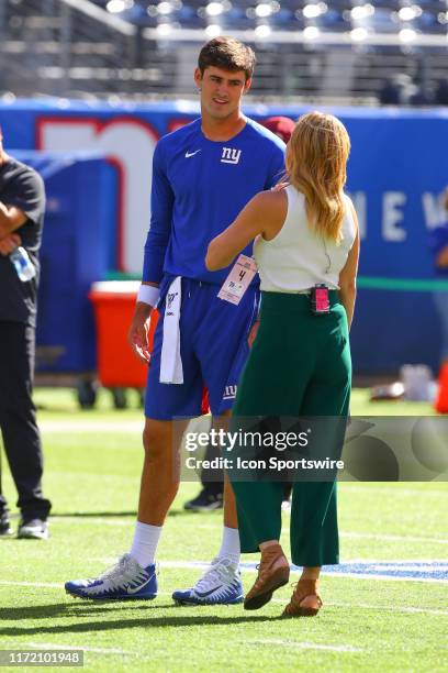 New York Giants quarterback Daniel Jones talks with Fox Sports Shannon Spake on the field during warm up prior to the National Football League game...