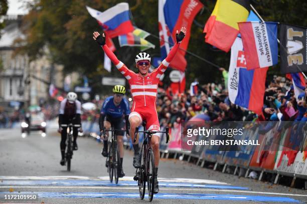 Denmark's Mads Pedersen celebrates his victory as he crosses the line in Harrogate to win the Men's Elite Road Race at the 2019 UCI Road World...