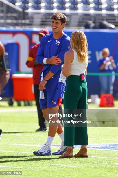 New York Giants quarterback Daniel Jones talks with Fox Sports Shannon Spake on the field during warm up prior to the National Football League game...