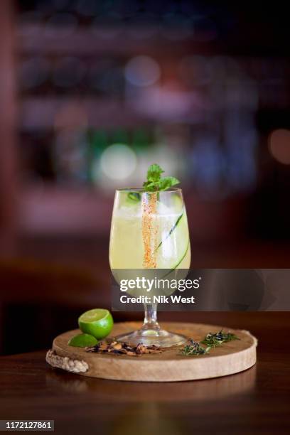 gourmet lime margarita on wooden serving board - mexican food and drink stock pictures, royalty-free photos & images