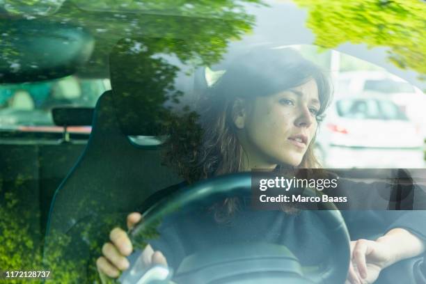 woman driving car - front view of car stock pictures, royalty-free photos & images