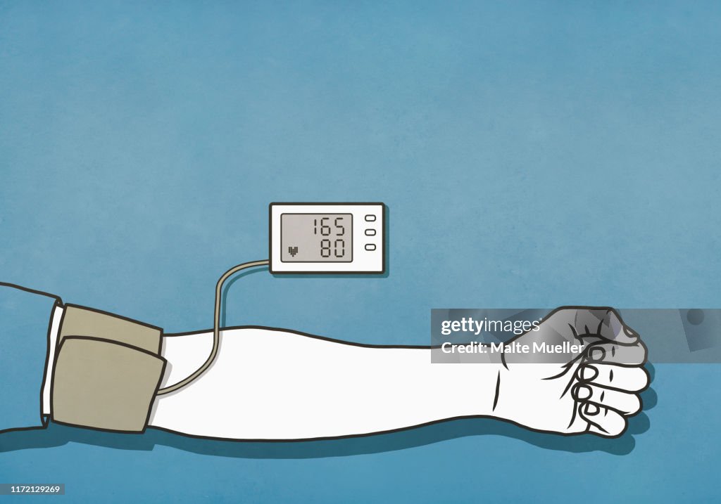 Man checking blood pressure with cuff and monitor, high blood pressure