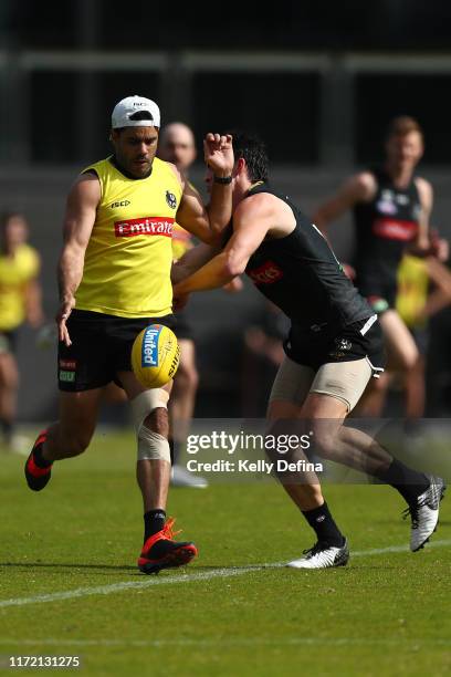 Daniel Wells of the Magpies kicks the ball during the Collingwood Magpies AFL training session at The Holden Centre on September 04, 2019 in...