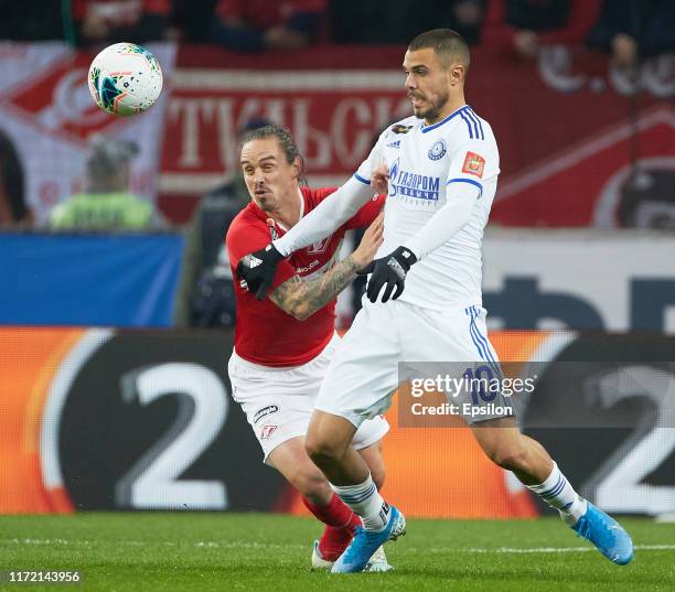 Andrey Yeshchenko of FC Spartak Moscow and Ricardo Alves of FC Orenburg vie for the ball during the Russian Premier League match between FC Spartak...