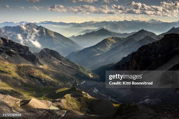 view of italian alps at the evening from guide d'ayas hut in monte rosa mountain range - castor foto e immagini stock