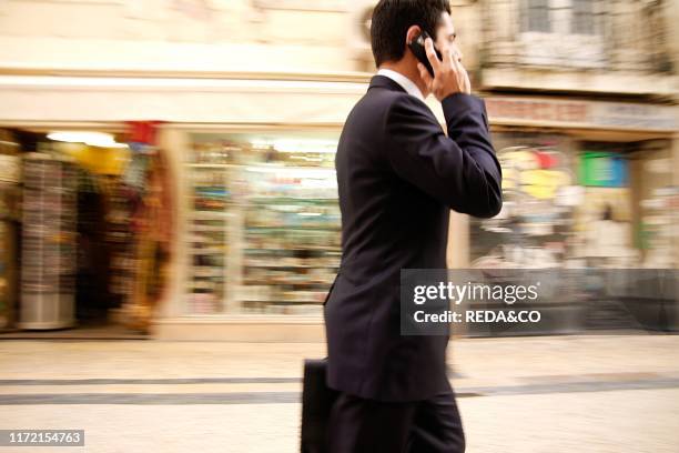 Man with mobile phone, Italy, Europe.