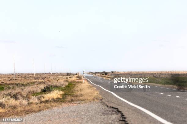 heat haze on the country highway in the dry, drought area of australia - rural queensland stock pictures, royalty-free photos & images