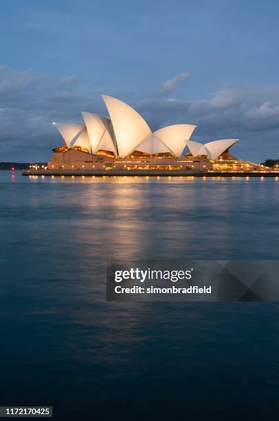 sydney opera house at dusk - sydney harbour bridge opera house stock pictures, royalty-free photos & images