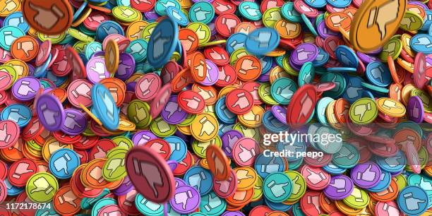 multi-coloured like and dislike icons in mid-air falling into pile - thumbs down emoji stock pictures, royalty-free photos & images
