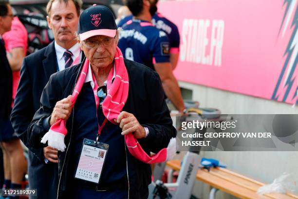 Stade Francais's German owner Hans-Peter Wild leaves the pitch after the French Top 14 rugby union match between Stade Francais Paris and ASM...