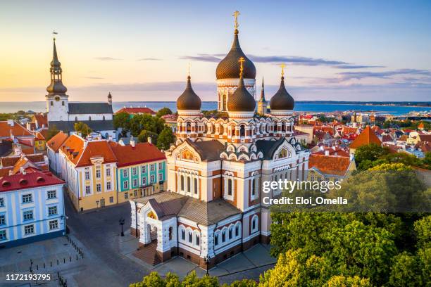 alexander nevsky cathedral and st mary's cathedral at sunset in tallinn, estonia - russian orthodoxy stock pictures, royalty-free photos & images